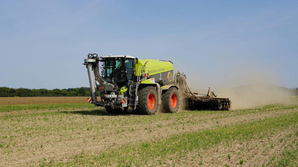 Modern farming machinery working in a field in Geesthacht, capturing agricultural technology in action.